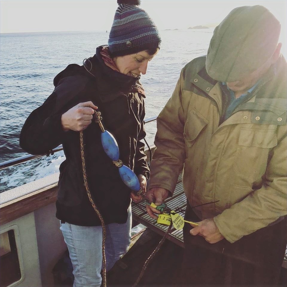 Marine Ranger Genine deploying a temperature logger offshore with a partner from Eyemouth Marine.